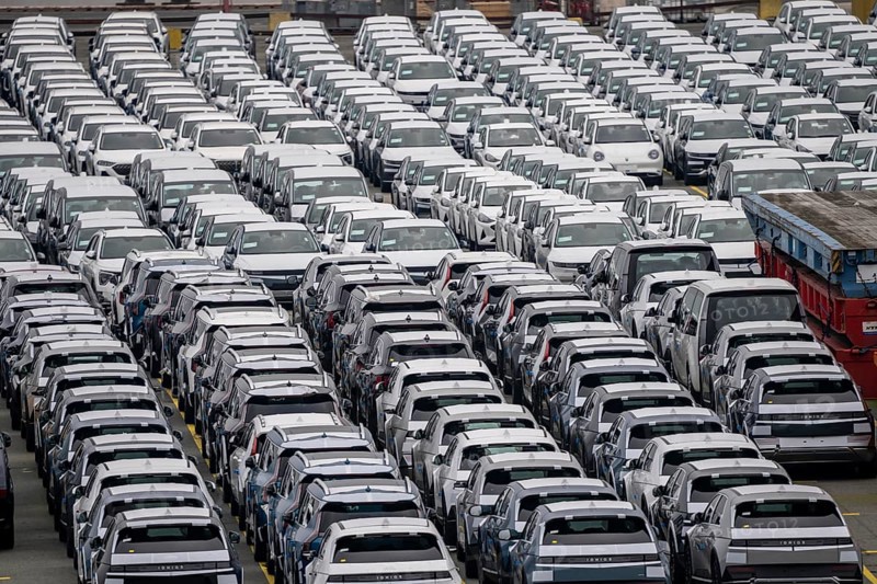 Parking space for import vehicles, hundreds of Hyundai Ioniq, electric cars, waiting for onward transport, at the EUROGATE container terminal in the overseas harbour of Bremerhaven, Lower Saxony, Germany, Europe