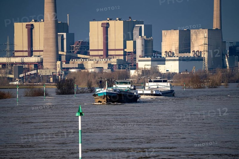 Cargo ships on the Rhine near Rheinberg, in the background the decommissioned Voerde coal-fired power station, which is currently being dismantled, flood, North Rhine-Westphalia, Germany, Europe