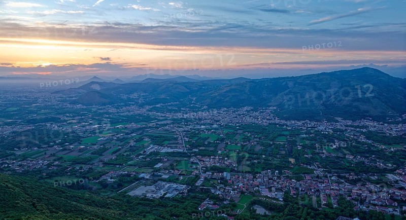 View of the densely populated Neapolitan region and the mountains near Caserta at dusk. San Felice a Cancello, Caserta, Campania, Italy, Southern Europe, Europe