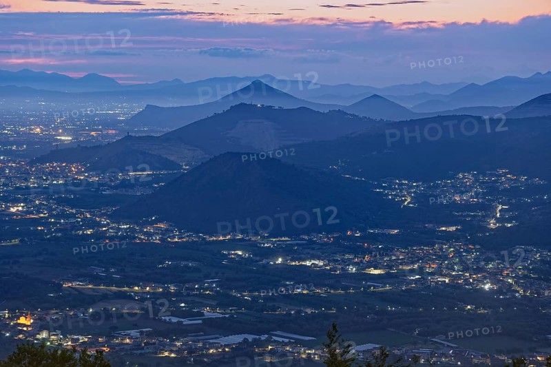 View of the densely populated Neapolitan region and the mountains near Caserta at dusk. San Felice a Cancello, Caserta, Campania, Italy, Southern Europe, Europe