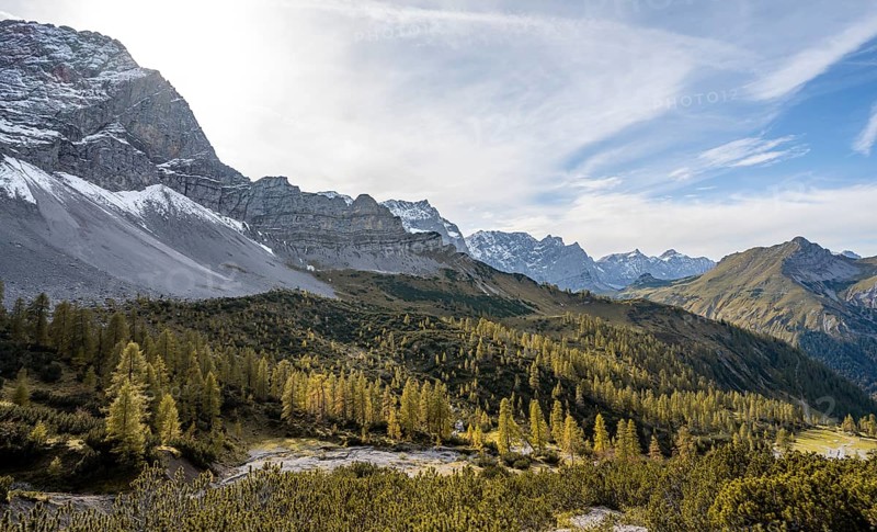 Mountain panorama with steep rocky peaks, yellow-coloured larches in autumn, hike to the summit of the Hahnkampl, Engtal, Karwendel, Tyrol, Austria, Europe