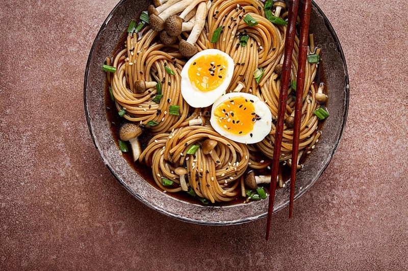 Buckwheat noodles, soba, with shimeji mushrooms, boiled egg, green onion, sesame seeds, homemade, no people