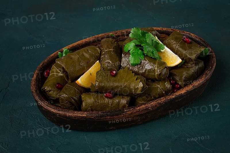 Dolma (Tolma) stuffed rolls, minced meat with rice, in grape leaves, top view, no people, close-up