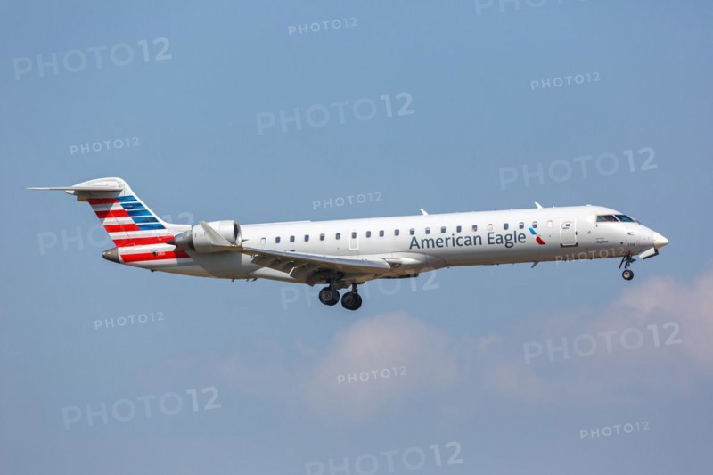 A Bombardier CRJ700 aircraft of American Eagle SkyWest Airlines with the registration number N708SK at Dallas Fort Worth Airport, USA, North America