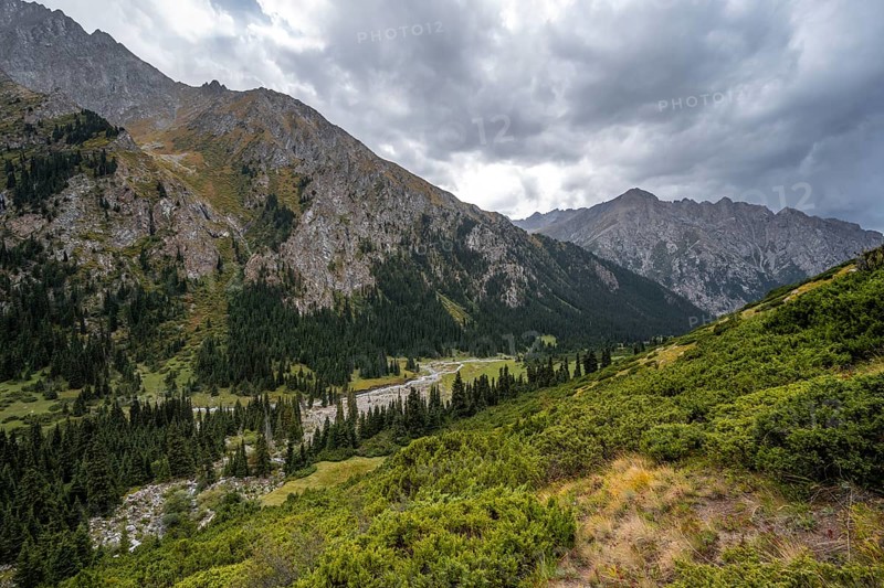 Green mountain valley with river and steep mountain peaks, Chong Kyzyl Suu Valley, Terskey Ala Too, Tien-Shan Mountains, Kyrgyzstan, Asia