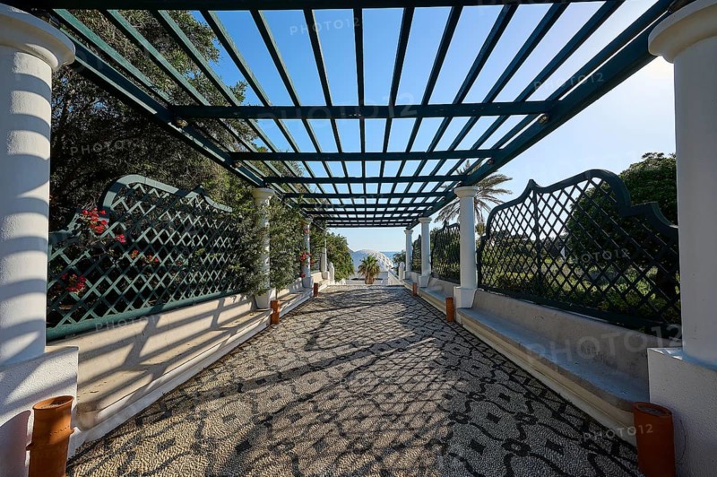 Covered walkway with pergola and geometric patterns, cast shade and view of nature, thermal springs, thermal baths, thermal baths of Kallithea, Kallithea, Rhodes, Dodecanese, Greek Islands, Greece, Europe