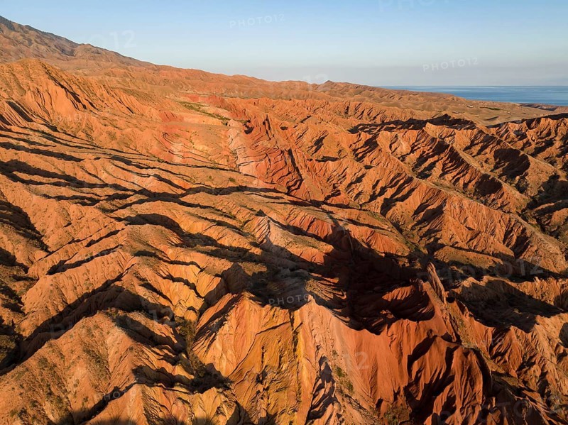 Aerial view, eroded mountain landscape, sandstone cliffs, canyon with red and orange rock formations, Farytale Canyon Skazka, Issyk Kul, Kyrgyzstan, Asia