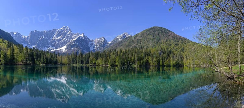 Mangart mountain range reflected in the lower Fusine Lake, Tarvisio, province of Udine, Italy, Europe