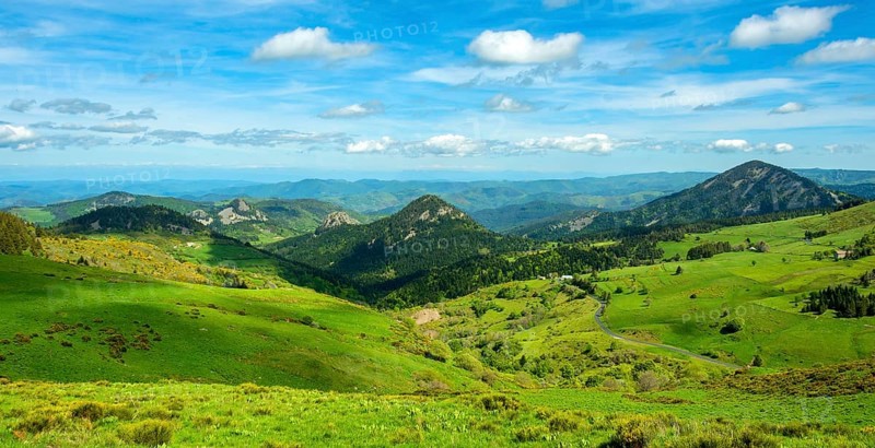 Scenic View of Dome-Shaped Volcanic Peaks (Sucs) in the Monts d'Ardeche Regional Natural Park. Auvergne-Rhone-Alpes. France