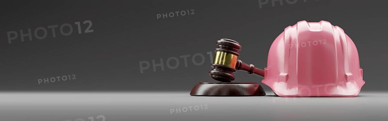 Pink hard hat and gavel on a gradated background banner with room for text or graphics