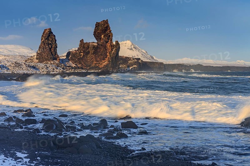 Rocks and surf on the coast, evening light, sun, snow, winter, Arnarstapi, Snaefellsnes, Vesturland, Iceland, Europe