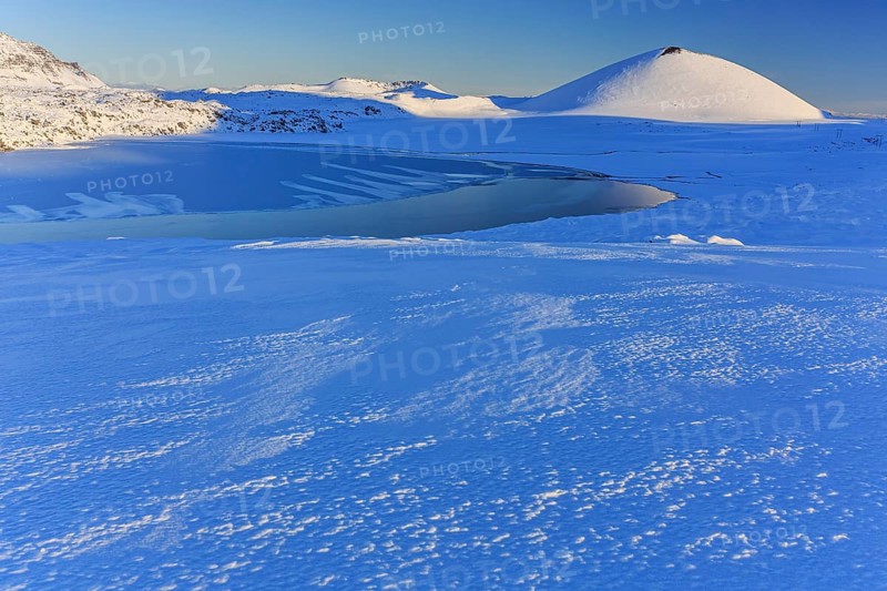 Morning light on a snowy lava field, lake, volcanic crater, snow, winter, Berserkjahraun, Snaefellsnes, Vesturland, Iceland, Europe