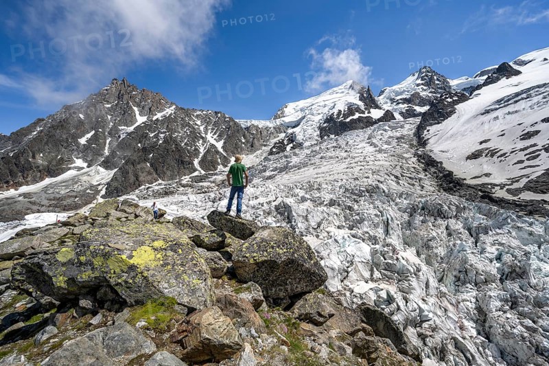 Mountaineers on the glacier, High alpine glaciated mountain landscape, La Jonction, Glacier des Bossons meets Glacier de Taconnaz, Summit of the Aiguille du Midi, Mont Maudit and Mont Blanc, Chamonix, Haute-Savoie, France, Europe