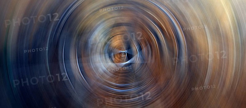 Horizontal abstract background featuring dark soft circles with circular glow lights rings in blue and orange