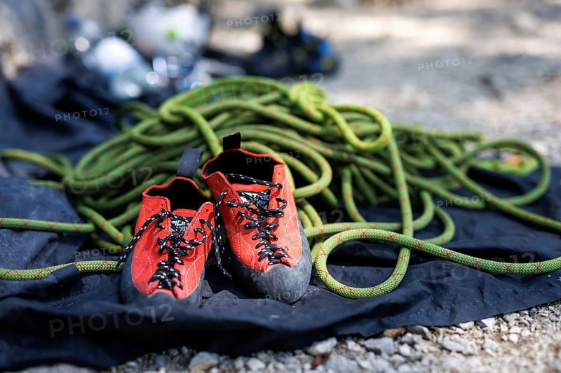 Special climbing shoes and a dynamic rope are part of the equipment for sport climbers on the rock. Taken in Morsbach, 09.07.2024