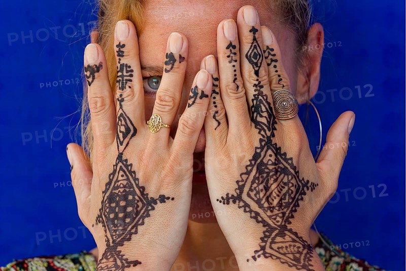 Woman with traditional Moroccan hand tattoo, henna, tattoo, craft, tradition, traditional, oriental, arabic, plant colour, body decoration, pattern, custom, jewellery, body painting, hand, eye, look, sign, symbol, design