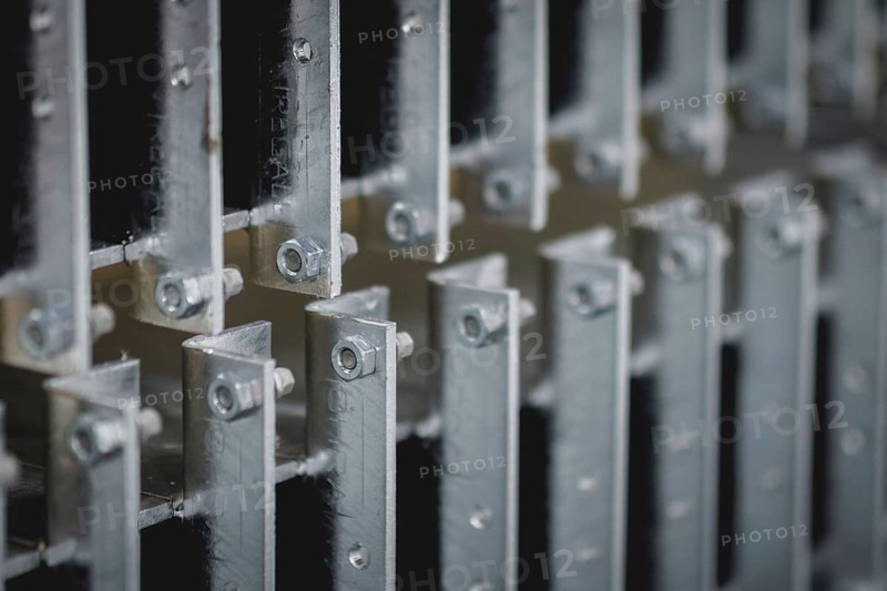 Finished galvanised steel parts lie in the factory hall of the surface finishing company Coatinc Company in Siegen, 22/08/2024