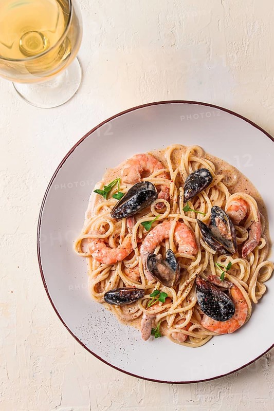 Spaghetti, pasta, with seafood, shrimp with mussels, in creamy garlic sauce, homemade, no people