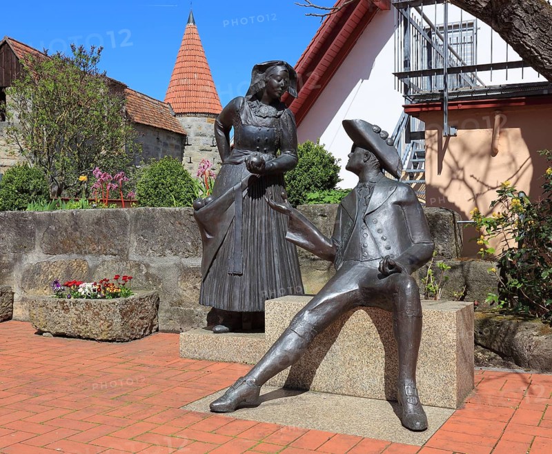 Monument to a pair of traditional costumes by Harro Frey in the vicarage in Effeltrich in Franconian Switzerland, district of Forchheim, Upper Franconia, Bavaria, Germany, Europe