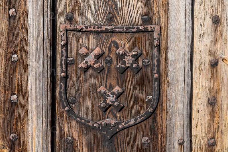 Old wooden door with hand-forged fittings, coat of arms, former Hanseatic city of Visby, UNESCO World Heritage Site, Gotland Island, Sweden, Europe