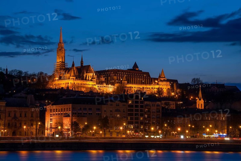 Royal Palace or the Buda Castle at sunset with lights illuminated at in danube river. Budapest Hungary europe