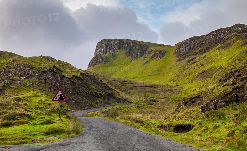 Empty mountain road at the picturesque and famous Quiraing mountain range at Trotternish area in the Isle of Skye, Scottish Highlands