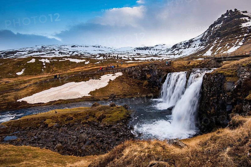 The Kirkjufell mountain and the kirkjufellfoss waterfall at grundarfjordur at Snaefellsnes peninsula in Iceland