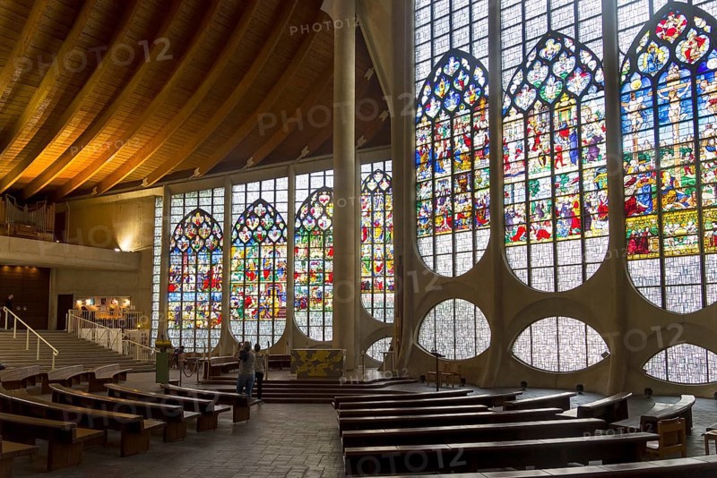 Rouen, France, August 30, 2018: Old Renaissance stained glass windows in a modern catholic church of Saint Joan of Arc, Europe