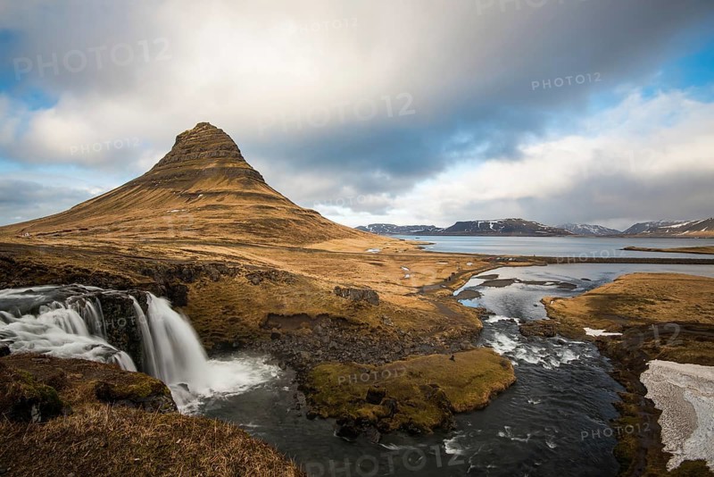 The Kirkjufell mountain and the kirkjufellfoss waterfall at grundarfjordur at Snaefellsnes peninsula in Iceland
