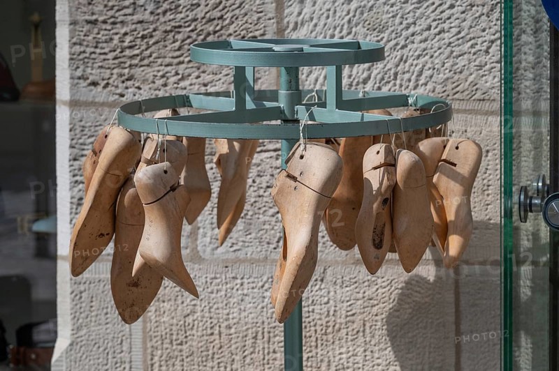 Shoe lasts on a stand in front of a shoemaker's shop, Iphofen, Lower Franconia, Bavaria, Germany, Europe
