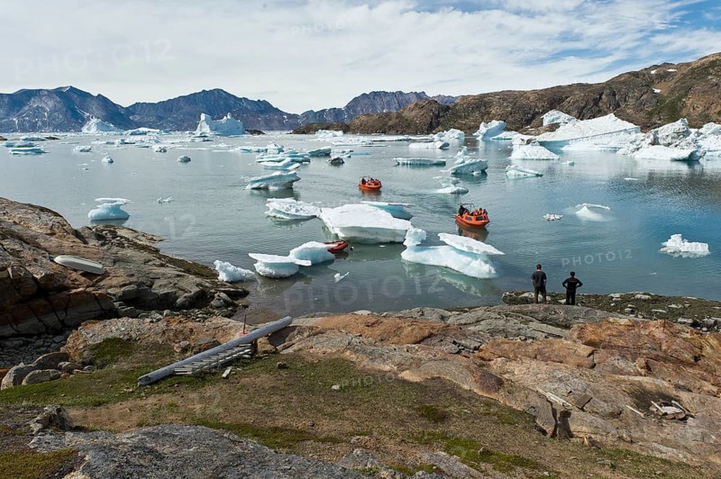 Motorboats on their way through icebergs to the Austrian polar station or polar research station Sermilik, Ammassalik Island, East Greenland, Greenland, North America