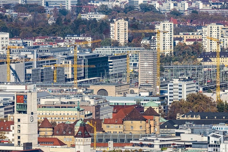 Central station with construction site Stuttgart 21, city centre with collegiate church, town hall tower, old castle and castle square. Behind it the new European quarter with modern office buildings. City view of Stuttgart Baden-Württemberg, Germany, Europe