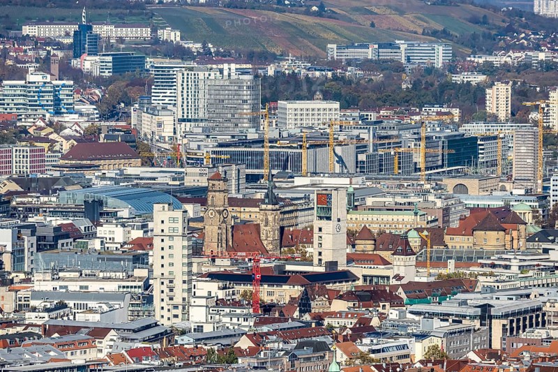 Central station with construction site Stuttgart 21, city centre with collegiate church, town hall tower, old castle and castle square. Behind it the new European quarter with modern office buildings. City view of Stuttgart Baden-Württemberg, Germany, Europe