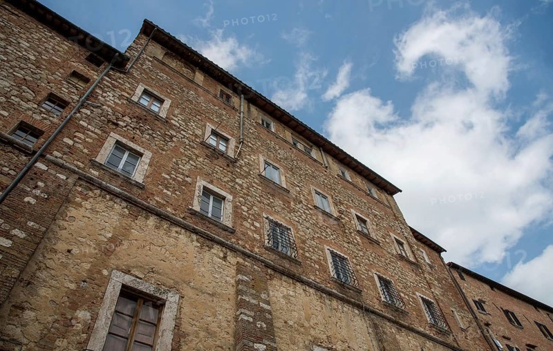 Medieval historical architecture buildings, Montepulciano, city Tuscany, Italy against blue sky