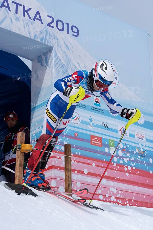 Sportswoman starter mountain skier at start line slalom, Alpine Skiing Cup at Russian Alpine Skiing Championship International Ski Federation Championship. Kamchatka Peninsula, Russia, March 28, 2019, Europe