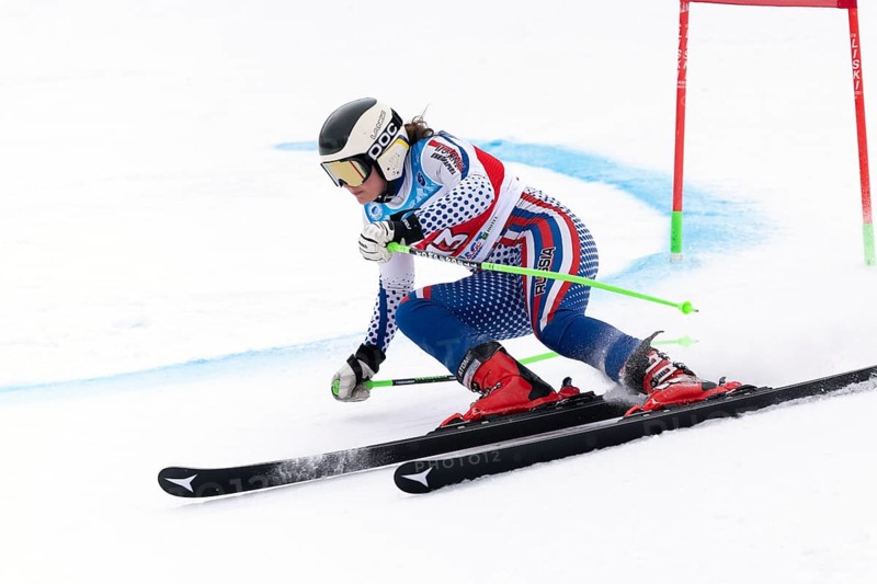 KAMCHATKA, RUSSIA, APR 2, 2019: Russian Women s Alpine Skiing Cup, International Ski Federation Championship, giant slalom. Mountain skier Khartsyzova Alena St. Petersburg skiing down mount slope