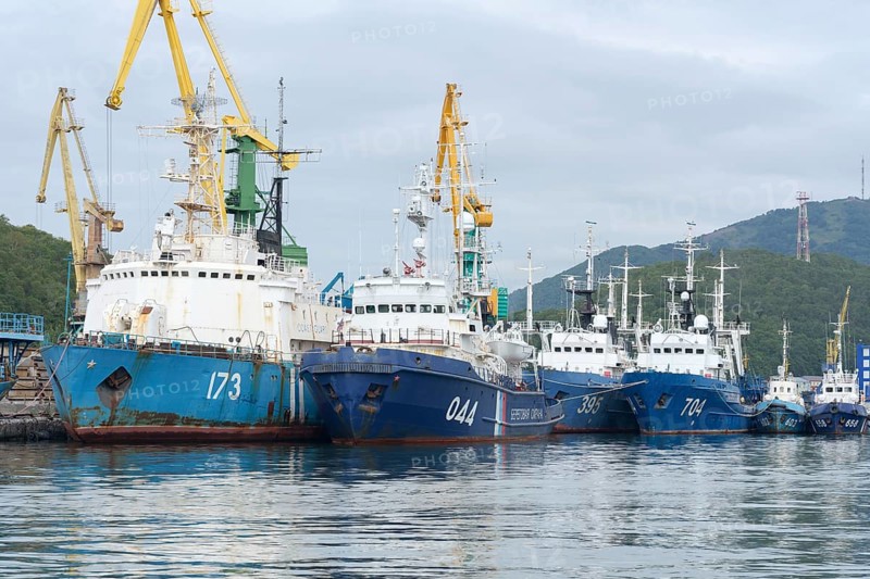 Group of warships Coast Guard of Border Guard Service of Russian FSB anchored at pier in Petropavlovsk-Kamchatsky sea port. Pacific Ocean, Kamchatka Peninsula, Russian Far East, 5 September, 2018