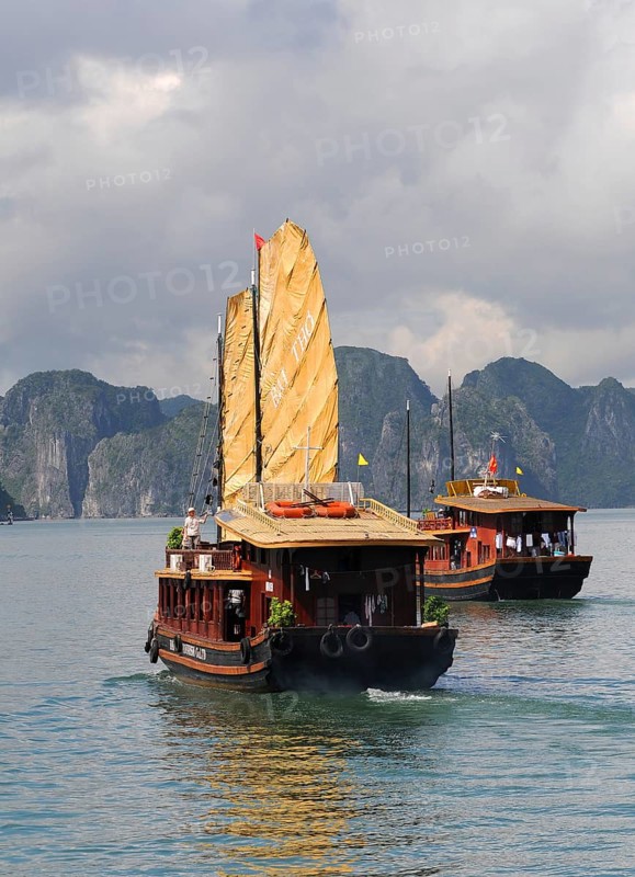 Halong Bay, Vietnam, August 5 2010: Tourist boat sailing on the famous Halong bay transferring tourists to enjoy the scenery in Vietnam, Asia