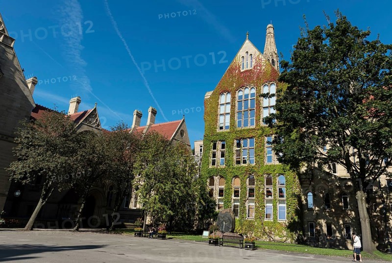 Manchester, United Kingdom, September 18, 2016: Manchester University Office main campus buildings with students enjoying the early morning sun, Europe
