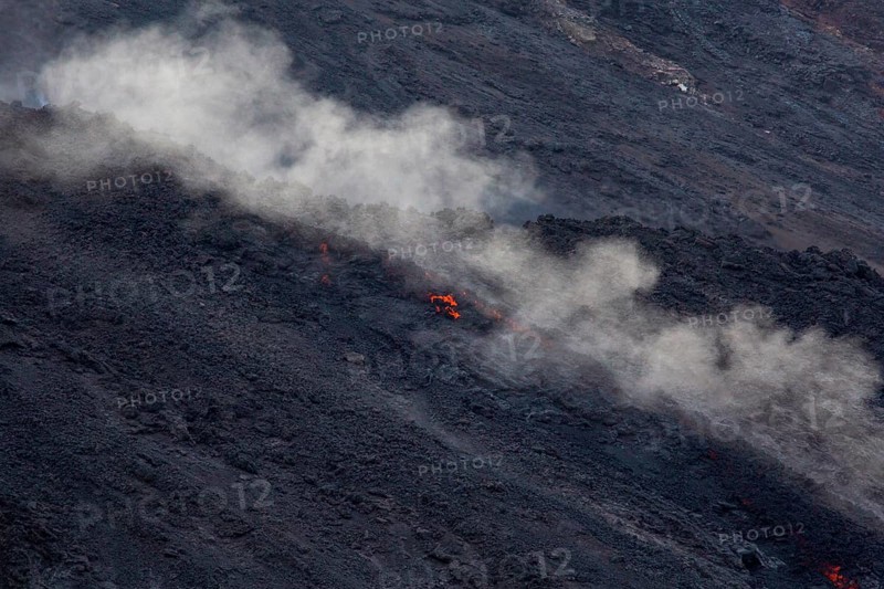 Glowing lava on lava rock from Stromboli crater