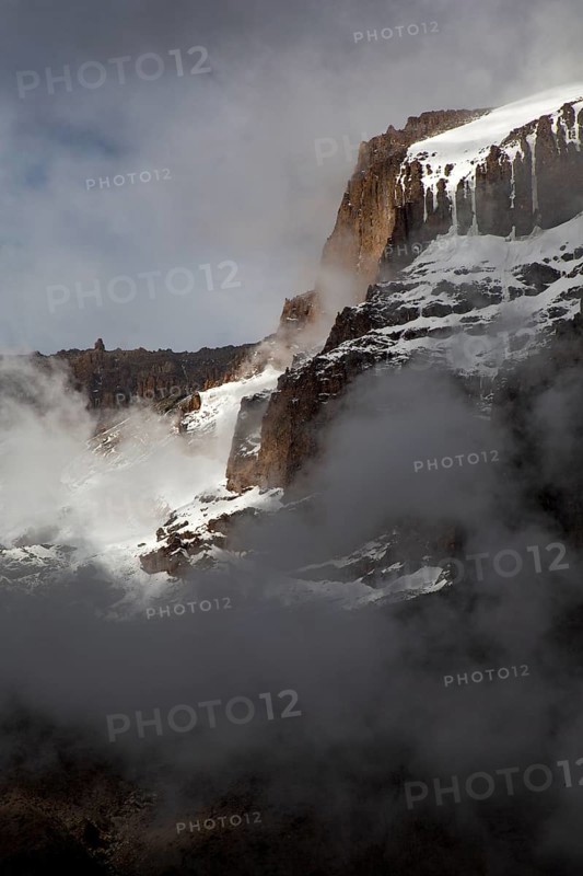 Summit of Kilimanjaro covered with snow and sunlight