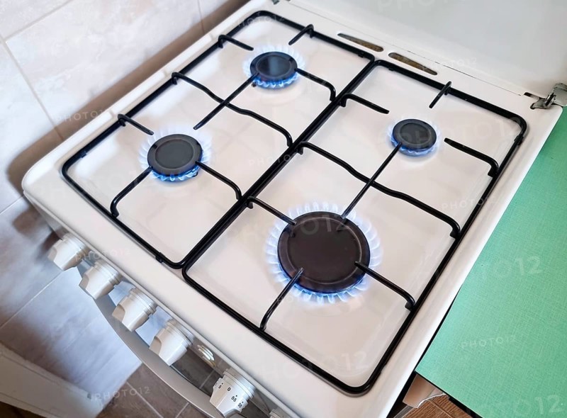 Energy efficiency concept with gas cooker – the cost of natural gas is more expensive. Selective focus
