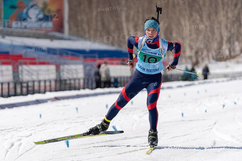 Sportsman biathlete Solodikov Ivan skiing on ski track distance biathlon arena during Junior biathlon competitions East of Cup. Petropavlovsk City, Kamchatka Peninsula, Russian Far East, Apr 14, 2019
