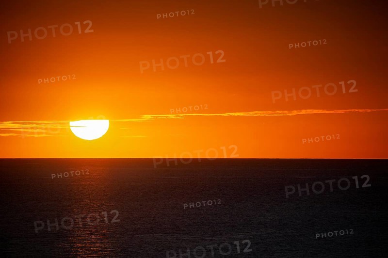 Texture of romantic setting sun with red sky