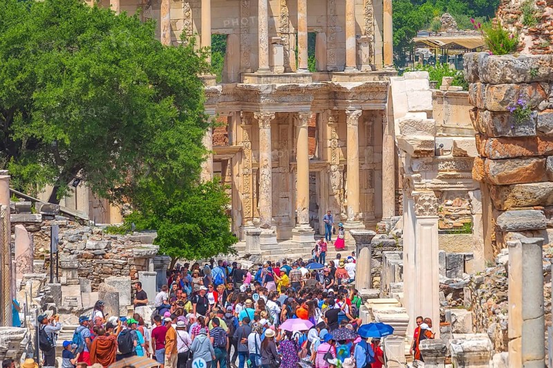 Kusadasi, Turkey, April 28, 2019: People visiting Celsus Library and old ruins of Ephesus or Efes famous site, Asia