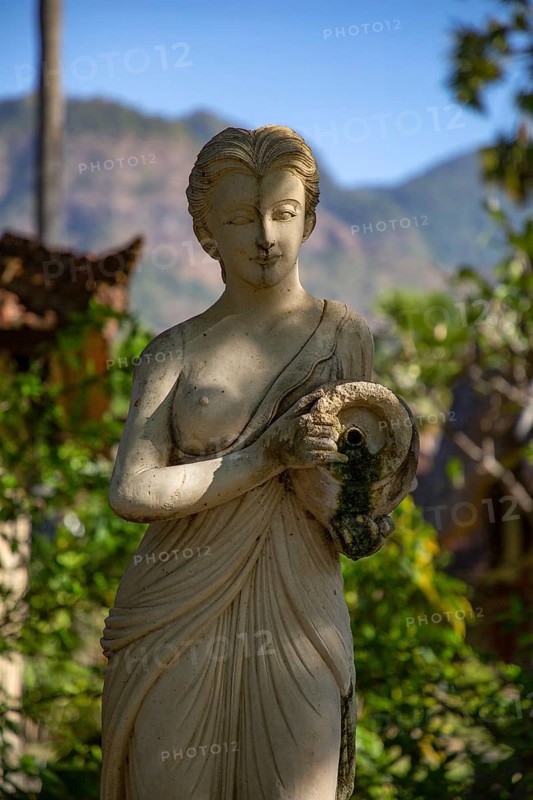 Beauty of the white woman with jug as sensual water bearer