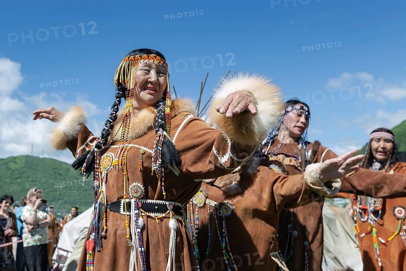 PETROPAVLOVSK CITY, KAMCHATKA PENINSULA, RUSSIA, JULY 11, 2015: Women in national clothing aborigine of Kamchatka expression dancing. Public concert national folklore dance group on Fishermans Day