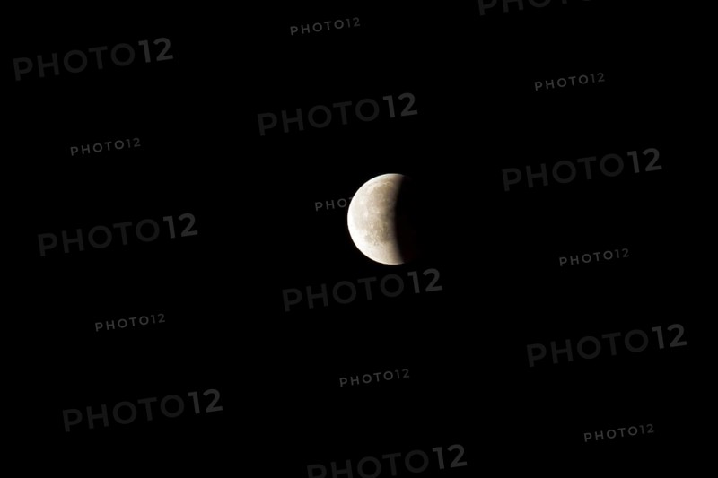 Full moon with shadow is eclipsed and only half of the moon is visible
