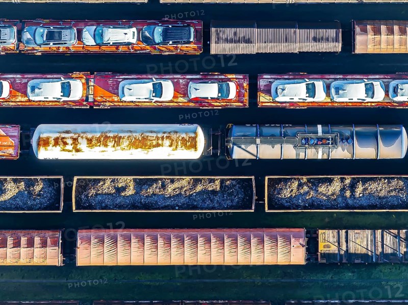 Deutsche Bahn AG marshalling yard. Many goods trains are parked on the tracks with tank wagons, car transporters and other wagons, companies transport a considerable part of their freight by rail, aerial view, Germany, Europe