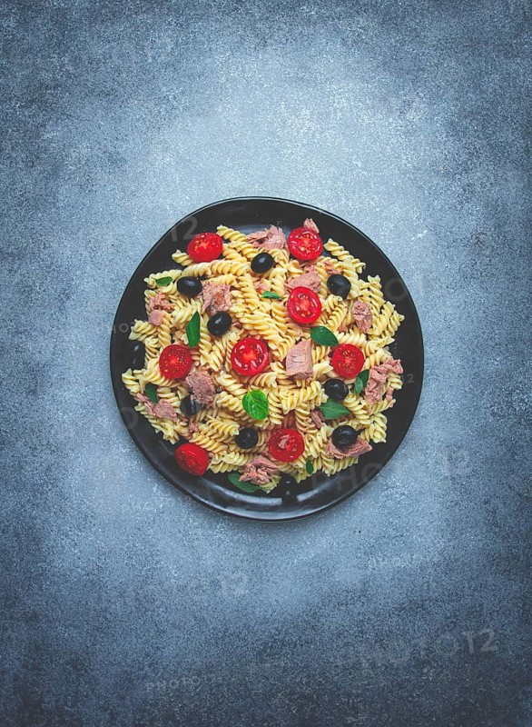 Tuna salad, fusilli pasta, olives and cherry, olive oil, homemade